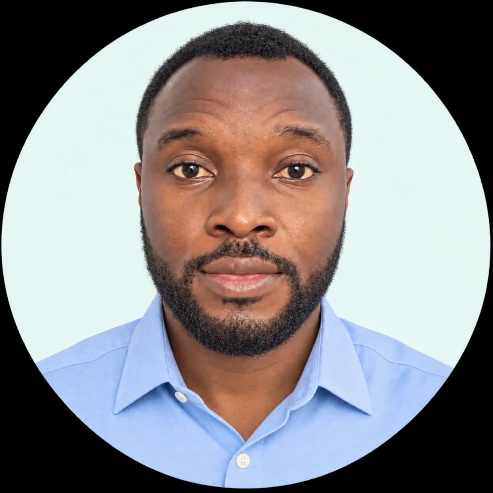 Portrait of Adekunle Okunade in a light blue shirt